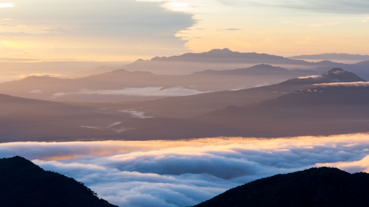A view of a mountain range at sunrise.