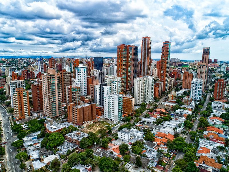 A cityscape. There are tall, redish brown buildings.