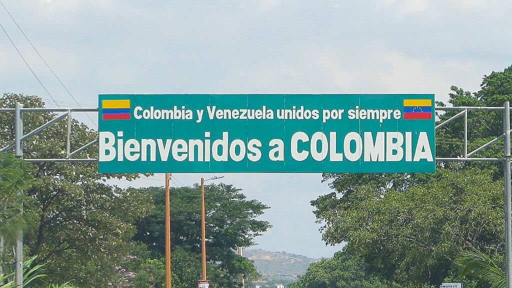 A sign with the words 'welcome to Colombia' written on it. It is a border crossing between Colombia and Venezuela